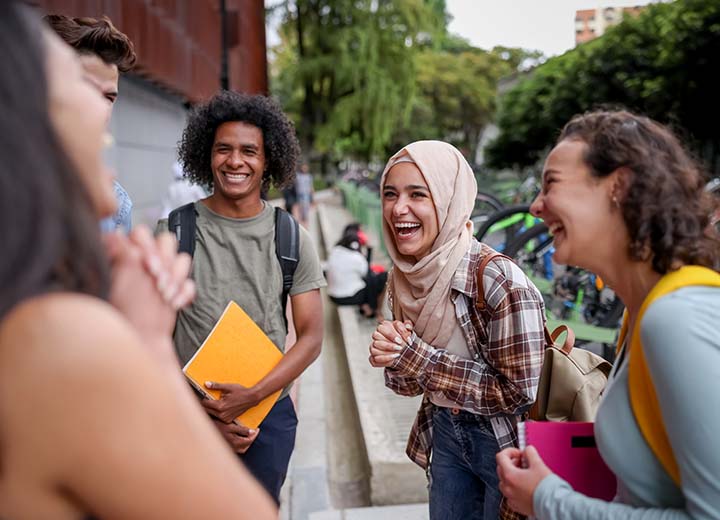 Group of students laughing together.